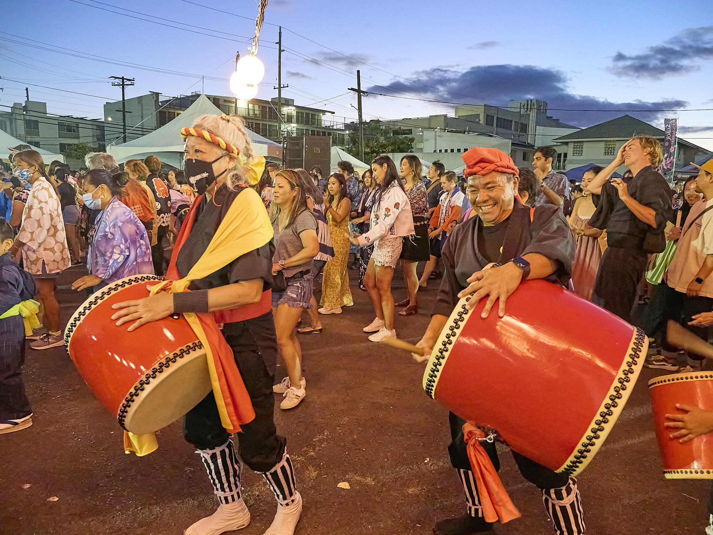 Okinawan community members in Hawaii performing traditional music and dance showcasing the distinct cultural identity of Okinawans in the islands